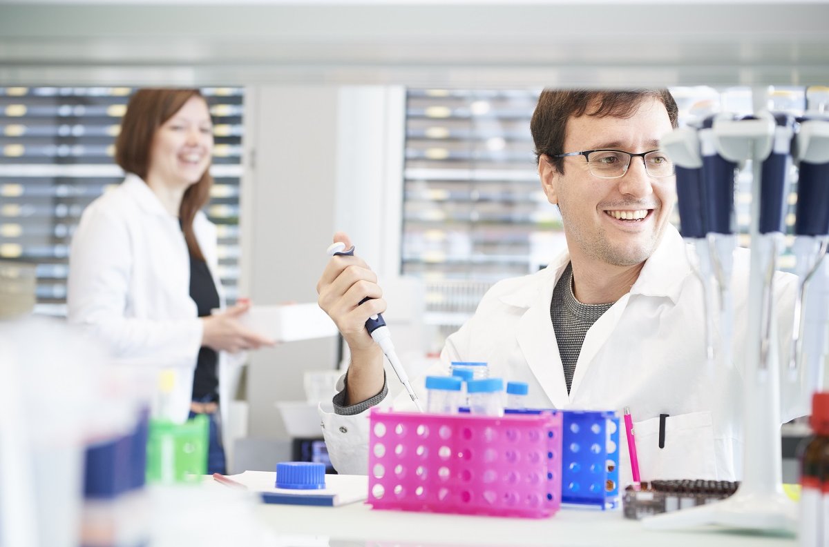 Two scientists laughing