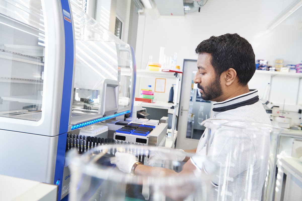 Scientist pipetting robot